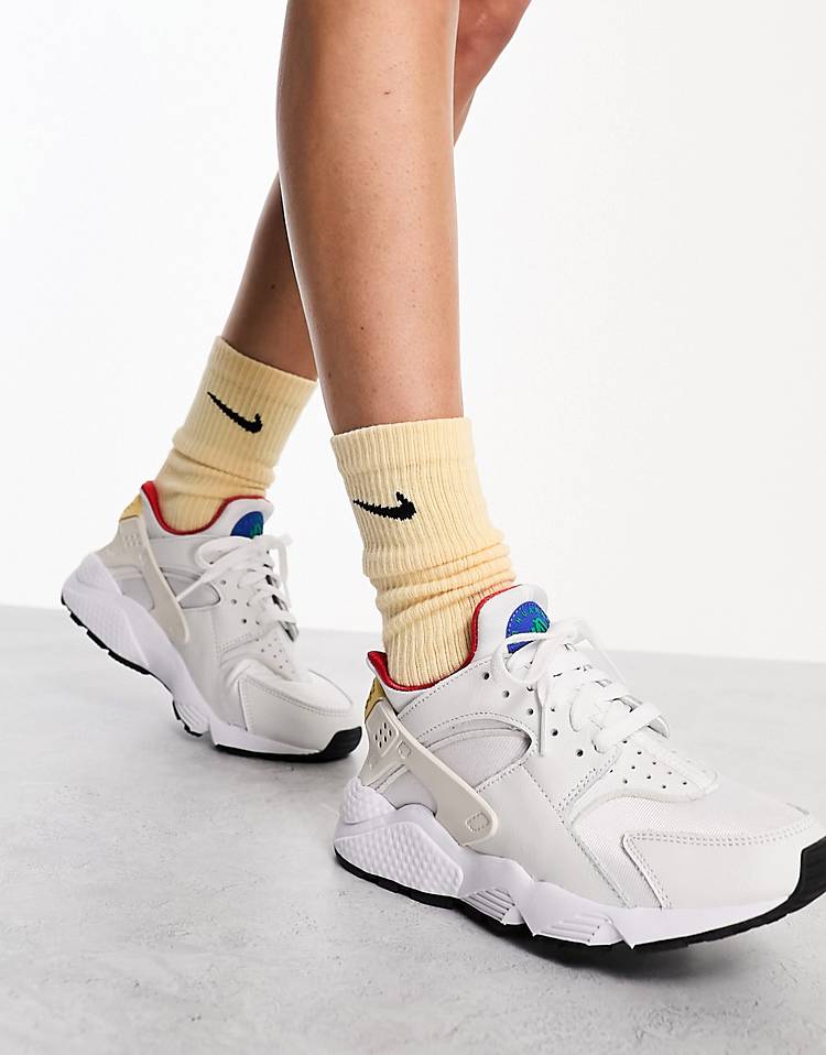 Nike Air Hurrache sneakers in white and gold